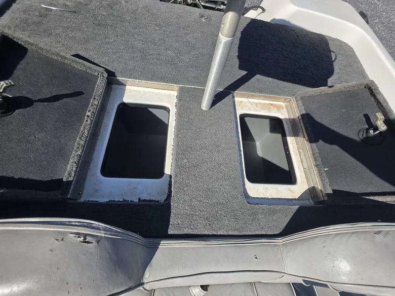 Slide: The Image of 1999 Generation III G3 Fiberglass boat interior with open storage compartments. - 14