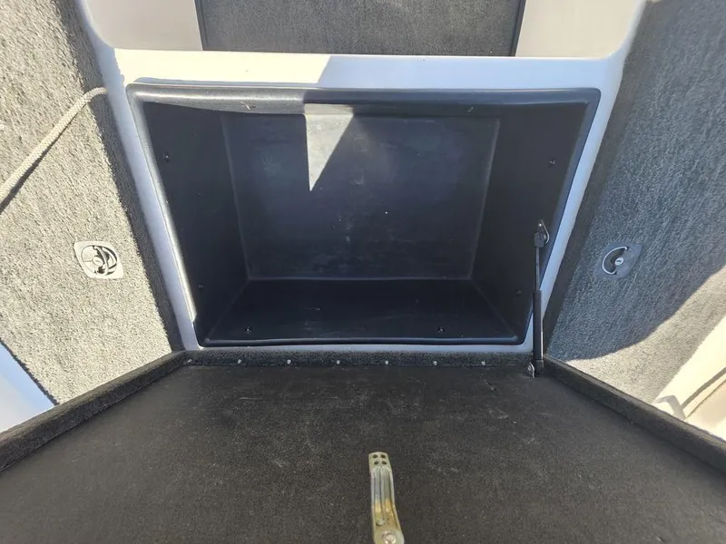 Slide: The Image of Open storage compartment in a 1999 Generation III G3 Fiberglass boat. - 17