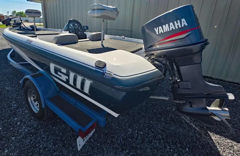 Slide: The Image of 1999 Generation III G3 Fiberglass boat with Yamaha motor on trailer. - 4