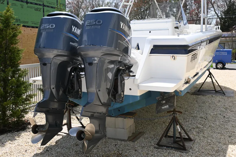 Slide: The Image of 2002 Intrepid 323 Cuddy with twin Yamaha 250 engines on display. - 2