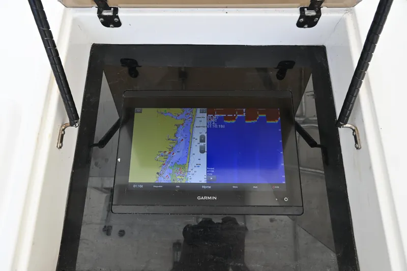 Slide: The Image of Garmin navigation system on 2002 Intrepid 323 Cuddy boat, displaying nautical map. - 29