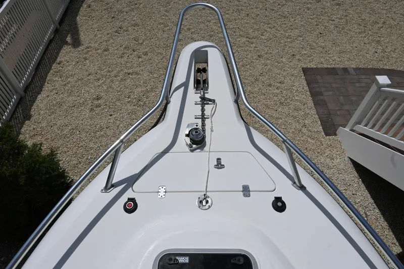 Slide: The Image of Bow view of 2002 Intrepid 323 Cuddy boat with anchor and railing. - 40