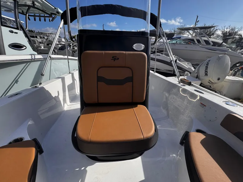 Slide: The Image of 2025 Sea Pro 202 Center Console boat interior with tan seating and modern design. - 21