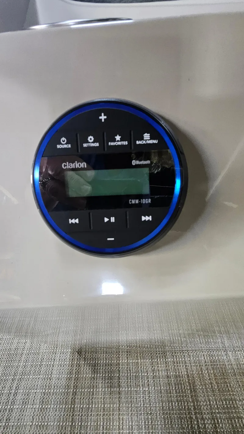 Slide: The Image of Clarion audio control panel in 2024 Veranda Vista 20RC boat. - 13