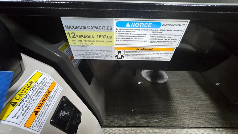 Slide: The Image of 2024 Veranda Vista 20RC capacity label, maximum 12 persons or 1692 lbs, safety warnings visible. - 7