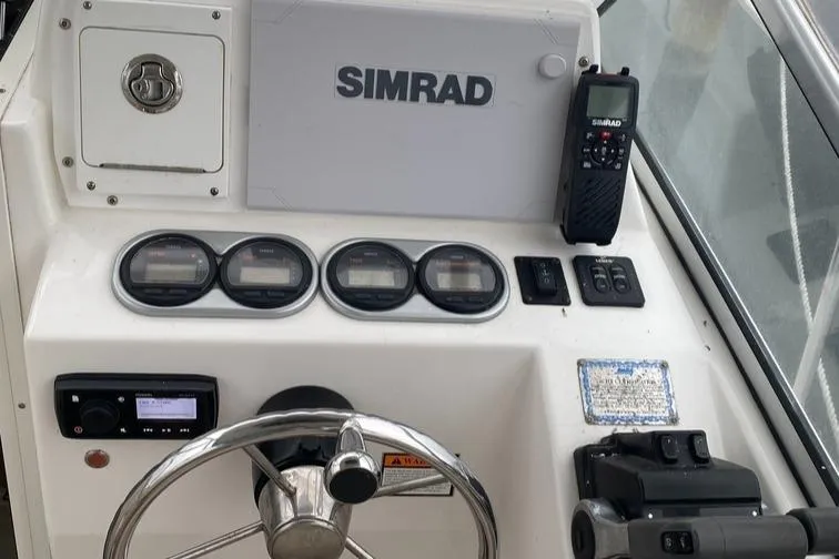 Slide: The Image of Control panel of 2004 Cobia 270 Walk-Around boat with Simrad electronics. - 5