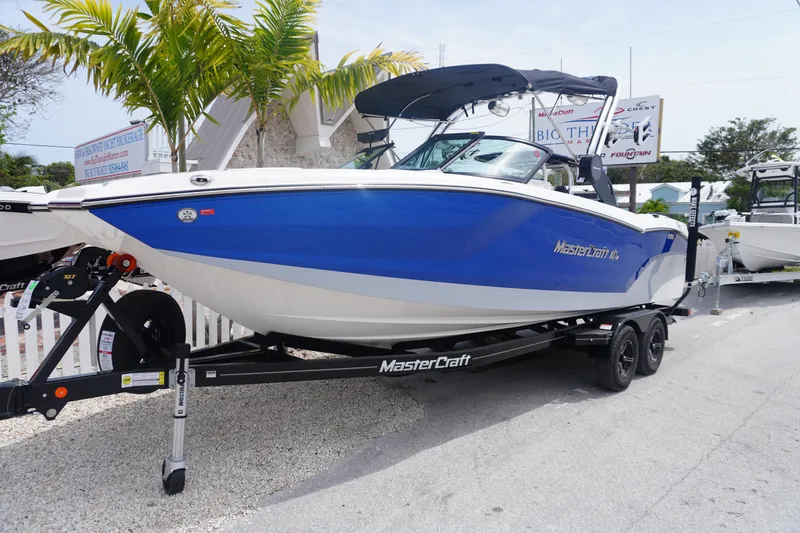 Slide: The Image of 2023 MasterCraft NXT24 boat with Klipsch speaker system and wakeboard rack. - 1