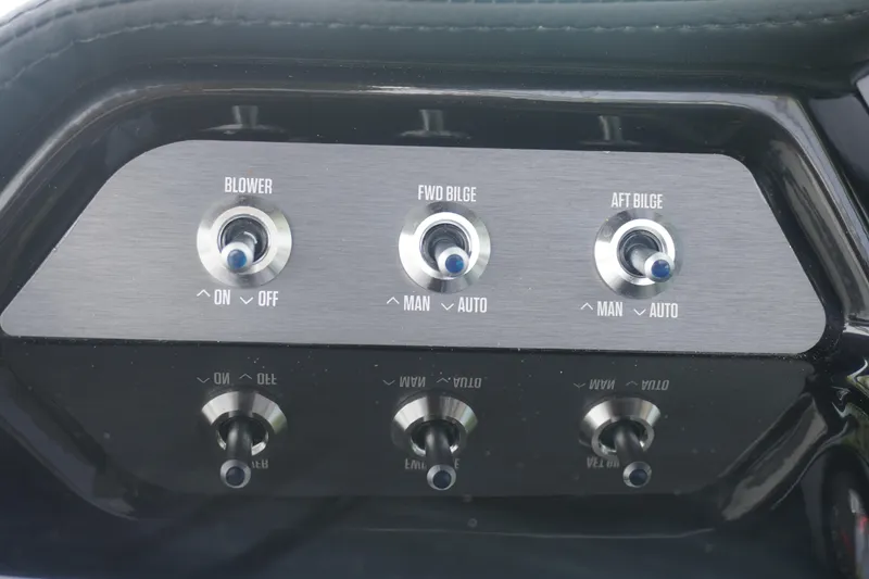 Slide: The Image of Control panel of 2023 MasterCraft NXT24 boat with blower and bilge switches. - 10