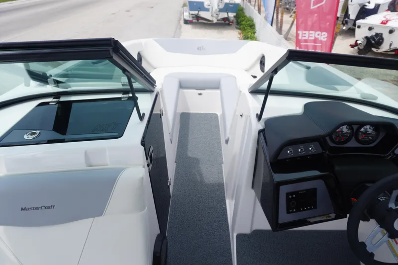 Slide: The Image of 2023 MasterCraft NXT24 boat interior with modern dashboard and seating. - 22