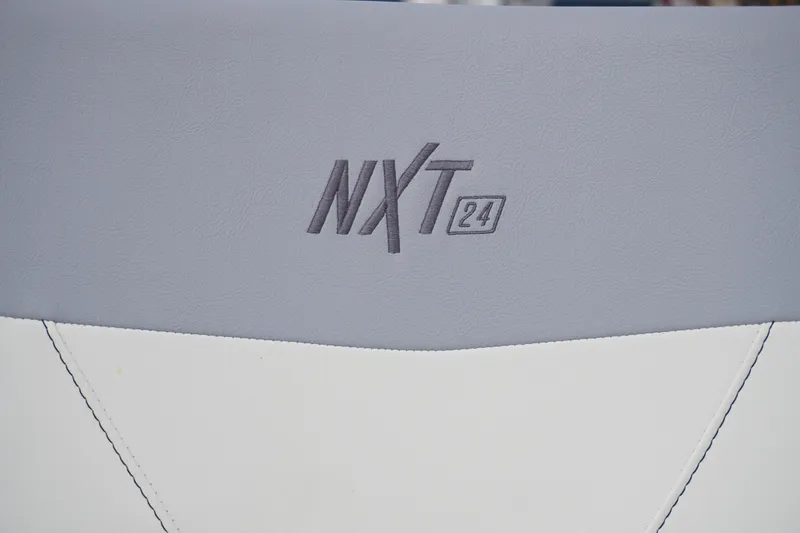 Slide: The Image of 2023 MasterCraft NXT24 boat seat with logo in gray and white upholstery. - 26