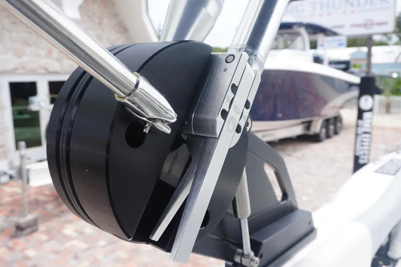 Slide: The Image of Close-up of 2023 MasterCraft NXT24 boat component, showcasing sleek metal and black design. - 33