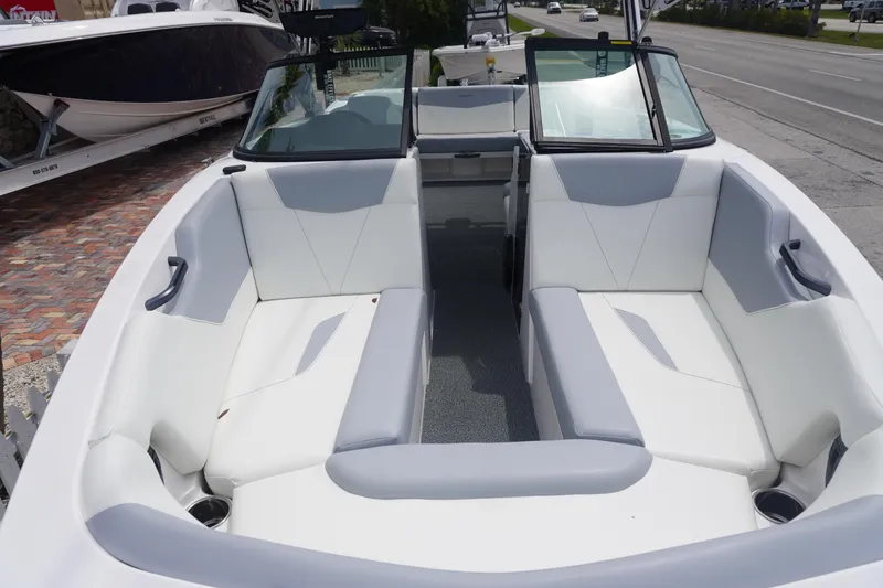 Slide: The Image of 2023 MasterCraft NXT24 boat interior with white seating and open bow design. - 36
