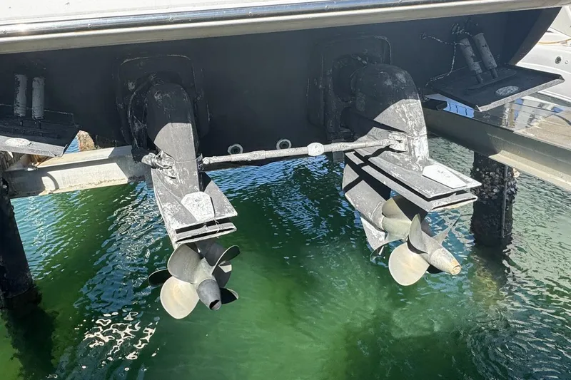 Slide: The Image of 2004 Sunseeker Sportfisher 37 boat propellers above green water. - 11