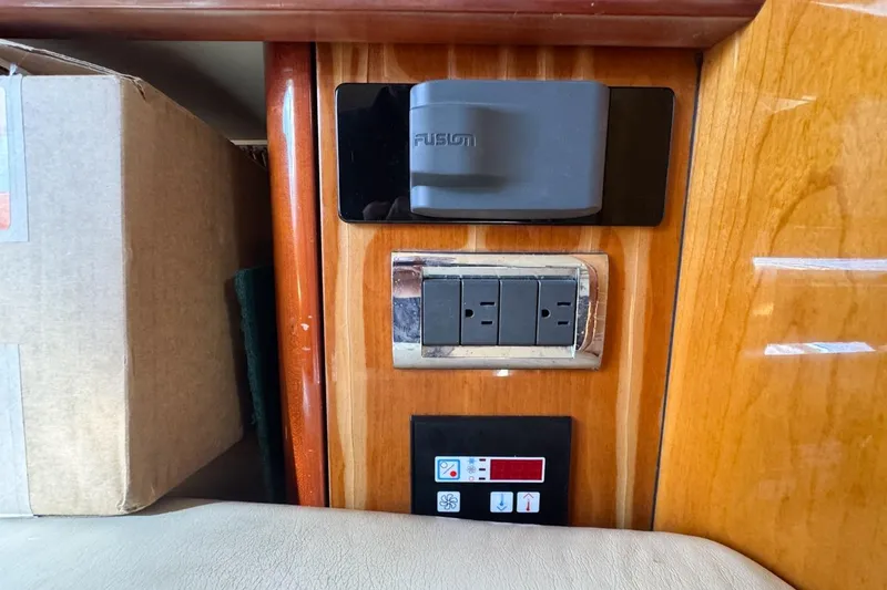 Slide: The Image of Interior of 2004 Sunseeker Sportfisher 37 showing electrical outlets and control panel. - 110