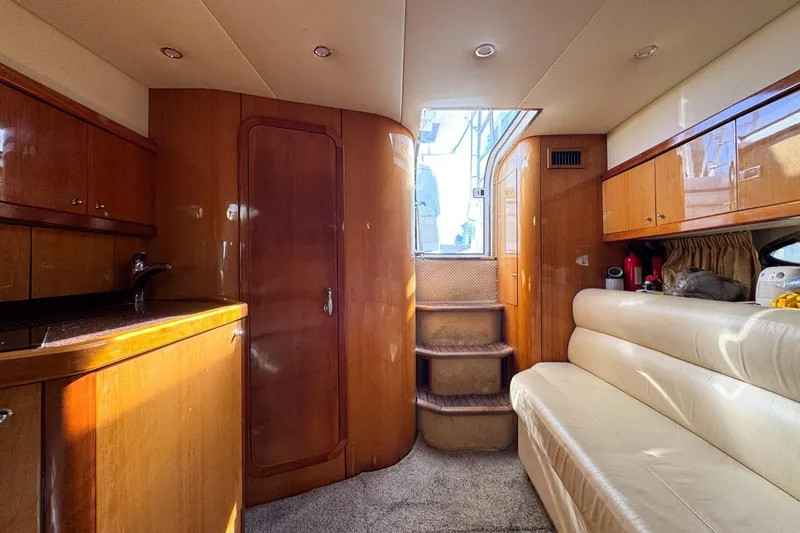 Slide: The Image of Luxurious interior of 2004 Sunseeker Sportfisher 37 yacht with wood finishes and seating. - 114