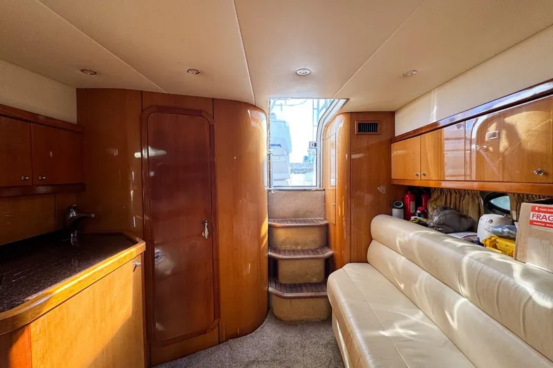 Slide: The Image of Luxurious interior of 2004 Sunseeker Sportfisher 37 yacht with wood finishes and seating. - 115