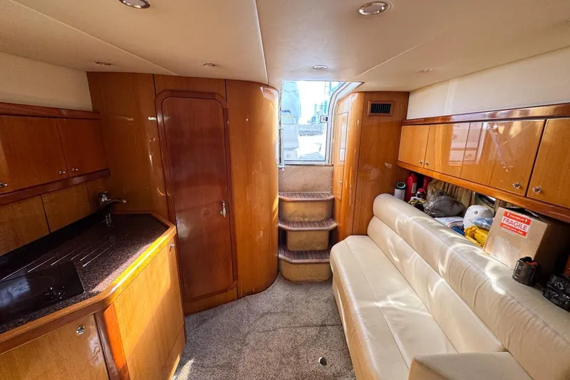 Slide: The Image of Luxurious interior of 2004 Sunseeker Sportfisher 37 yacht with wood finishes and leather seating. - 116