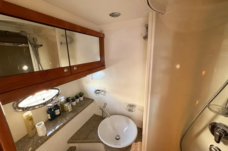Slide: The Image of Luxurious bathroom in 2004 Sunseeker Sportfisher 37 yacht with modern fixtures and elegant design. - 120