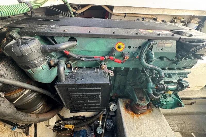 Slide: The Image of Engine compartment of a 2004 Sunseeker Sportfisher 37 boat, featuring a Volvo Penta engine. - 125