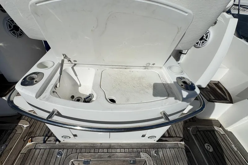Slide: The Image of 2004 Sunseeker Sportfisher 37 boat sink and cutting board on deck. - 18