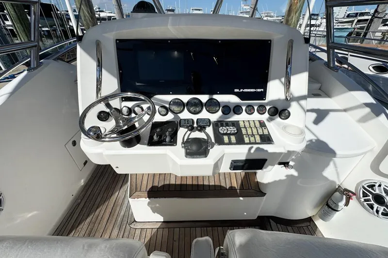 Slide: The Image of Sunseeker Sportfisher 37 helm, 2004 model, featuring steering wheel and control panel. - 19