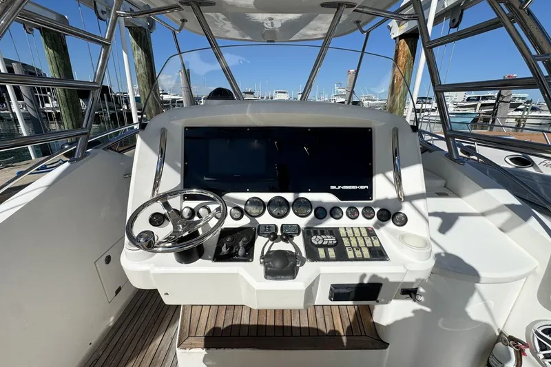 Slide: The Image of 2004 Sunseeker Sportfisher 37 helm with steering wheel and control panel. - 20