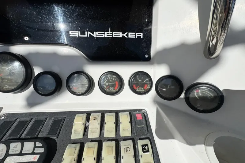 Slide: The Image of Control panel of 2004 Sunseeker Sportfisher 37 with gauges and switches. - 28
