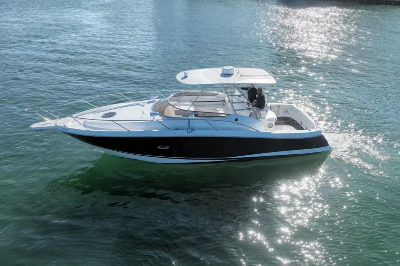 Slide: The Image of 2004 Sunseeker Sportfisher 37 boat cruising on sparkling water. - 1
