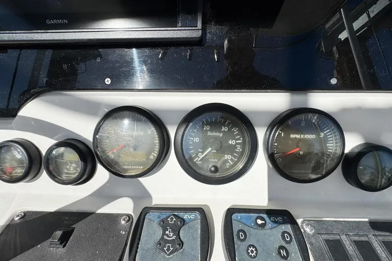Slide: The Image of Dashboard of a 2004 Sunseeker Sportfisher 37 with gauges and controls. - 29