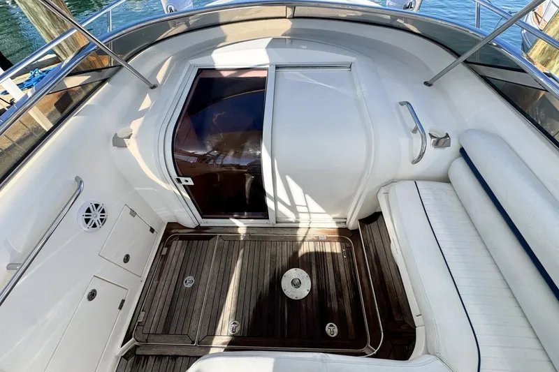 Slide: The Image of 2004 Sunseeker Sportfisher 37 boat interior with wooden flooring and white seating. - 30