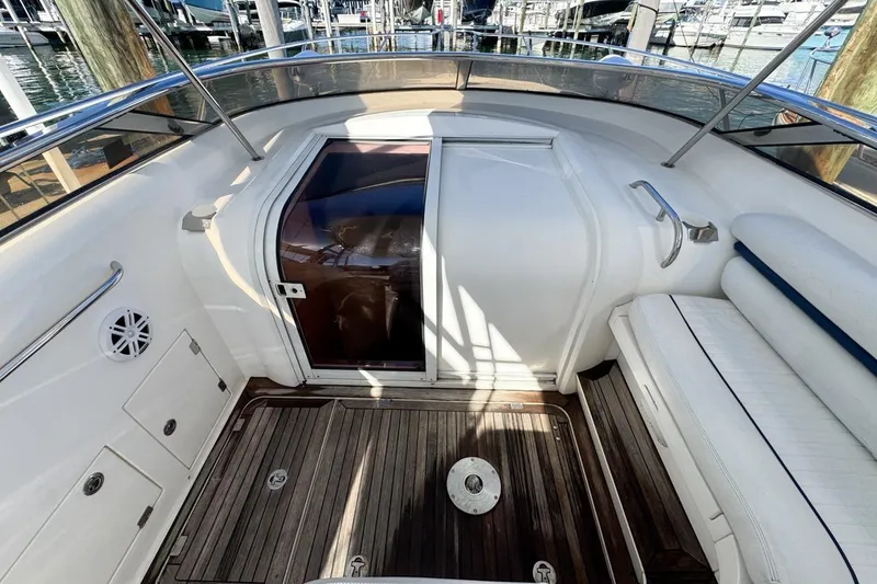 Slide: The Image of 2004 Sunseeker Sportfisher 37 boat interior with wooden deck and seating area. - 31