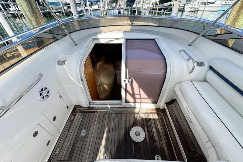 Slide: The Image of 2004 Sunseeker Sportfisher 37 boat interior with wooden deck and seating area. - 33