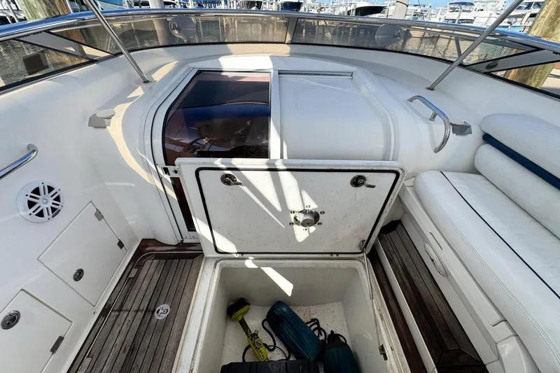 Slide: The Image of 2004 Sunseeker Sportfisher 37 boat interior with open storage compartment and seating. - 34