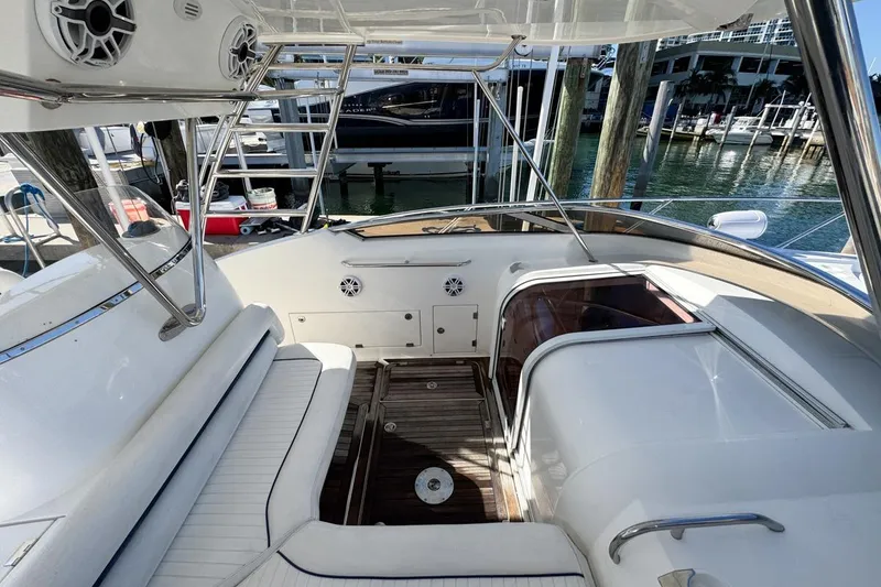 Slide: The Image of 2004 Sunseeker Sportfisher 37 boat interior with seating and wooden deck. - 40