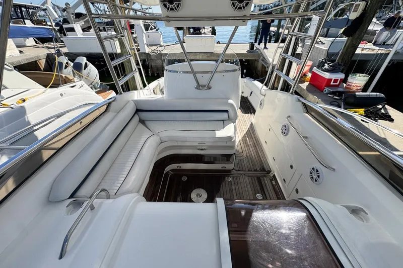 Slide: The Image of 2004 Sunseeker Sportfisher 37 boat interior with seating and deck view at marina. - 41
