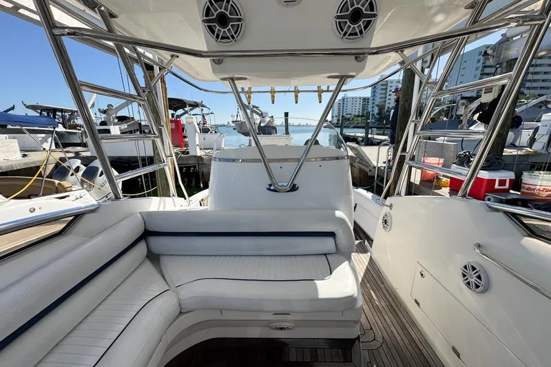Slide: The Image of 2004 Sunseeker Sportfisher 37 interior with seating, docked at marina. - 45