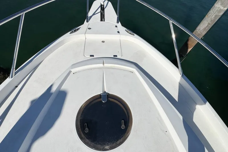 Slide: The Image of Bow view of 2004 Sunseeker Sportfisher 37 boat with sleek white deck. - 48