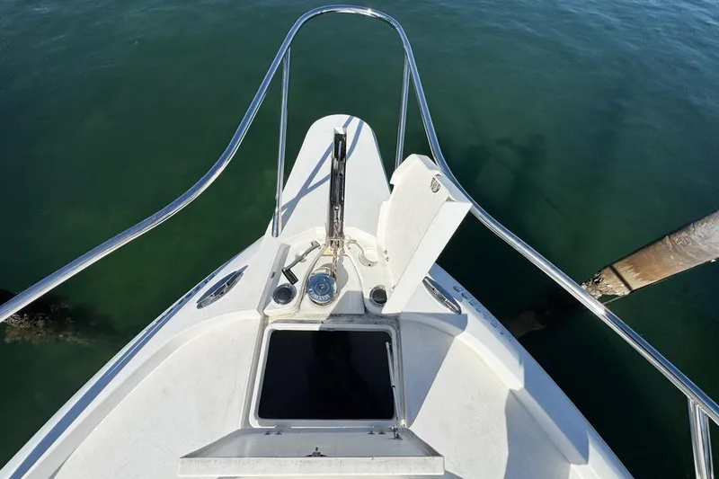 Slide: The Image of Bow view of 2004 Sunseeker Sportfisher 37, featuring anchor and open hatch. - 50