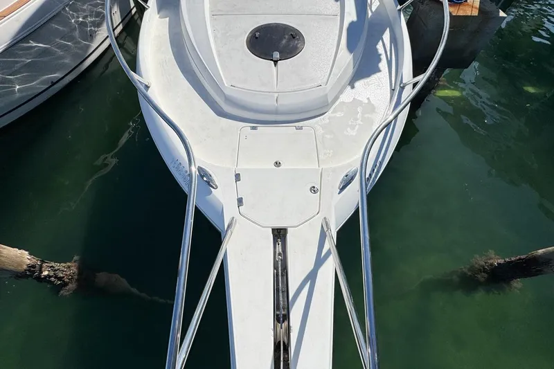 Slide: The Image of Bow view of 2004 Sunseeker Sportfisher 37 boat docked in clear water. - 52
