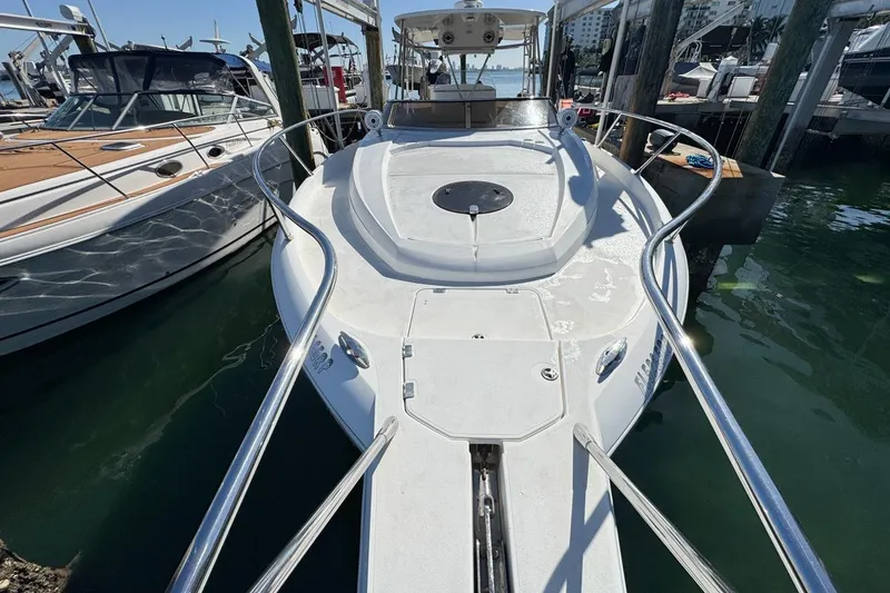 Slide: The Image of 2004 Sunseeker Sportfisher 37 docked, showcasing sleek design and spacious deck. - 54