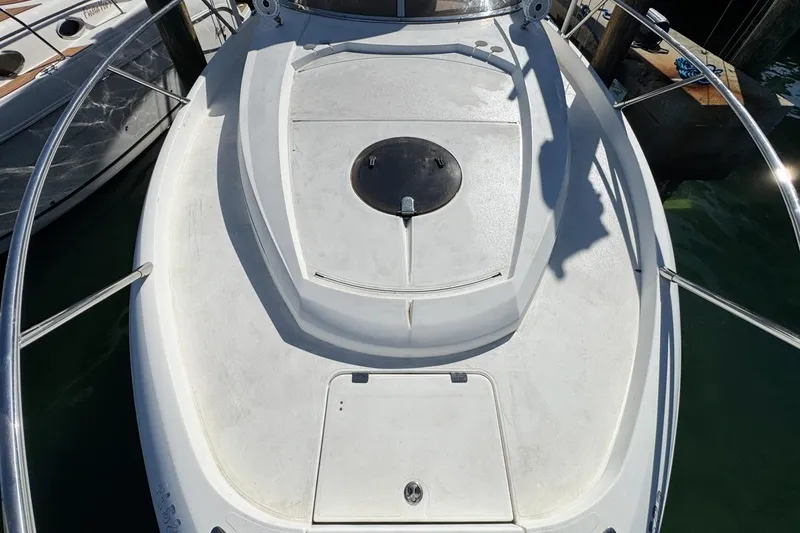 Slide: The Image of 2004 Sunseeker Sportfisher 37 boat deck with railing, docked at marina. - 55