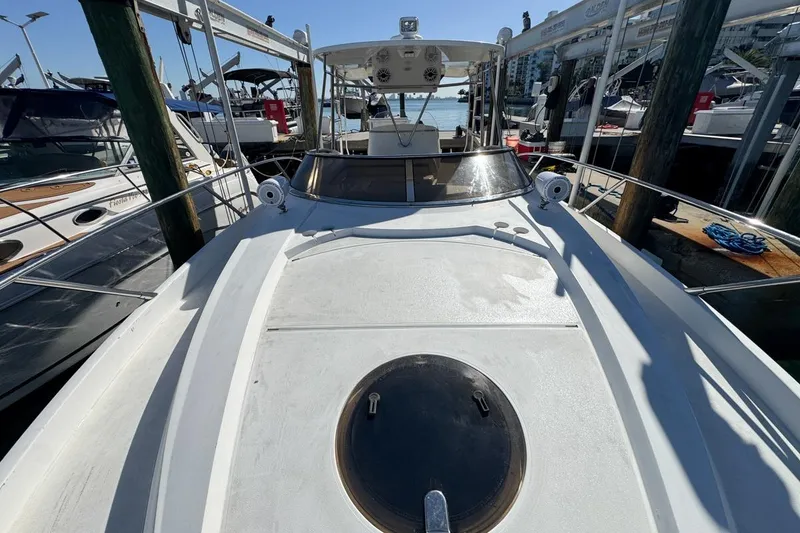 Slide: The Image of 2004 Sunseeker Sportfisher 37 docked, showcasing sleek deck and modern design. - 59