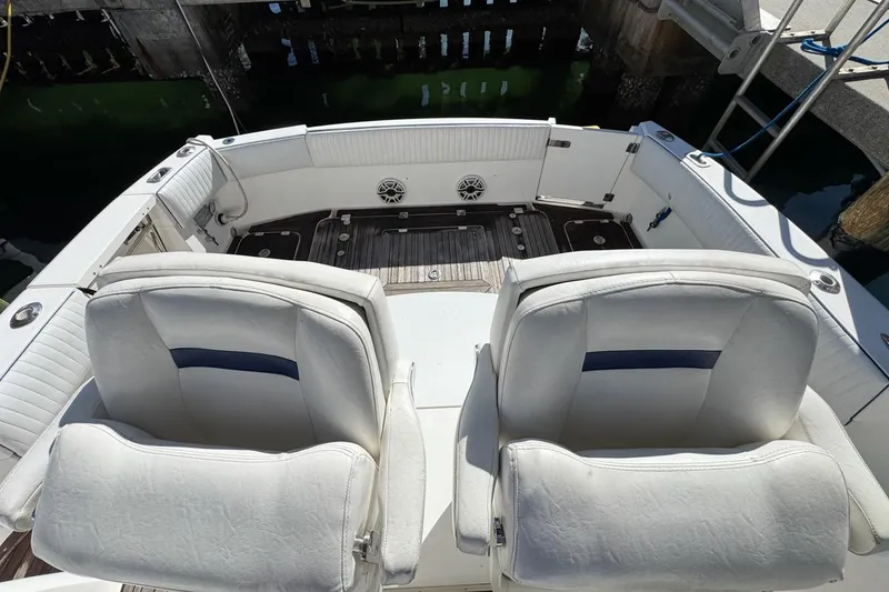 Slide: The Image of 2004 Sunseeker Sportfisher 37 boat interior with white seating and deck. - 69