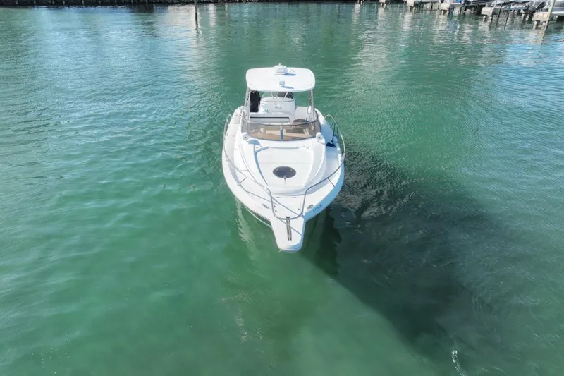Slide: The Image of 2004 Sunseeker Sportfisher 37 boat on calm green water, aerial view. - 6