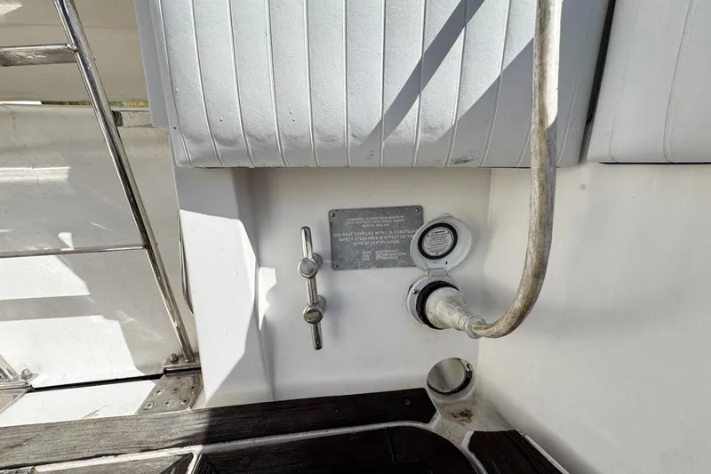 Slide: The Image of 2004 Sunseeker Sportfisher 37 boat deck with utility connections and metal fittings. - 75