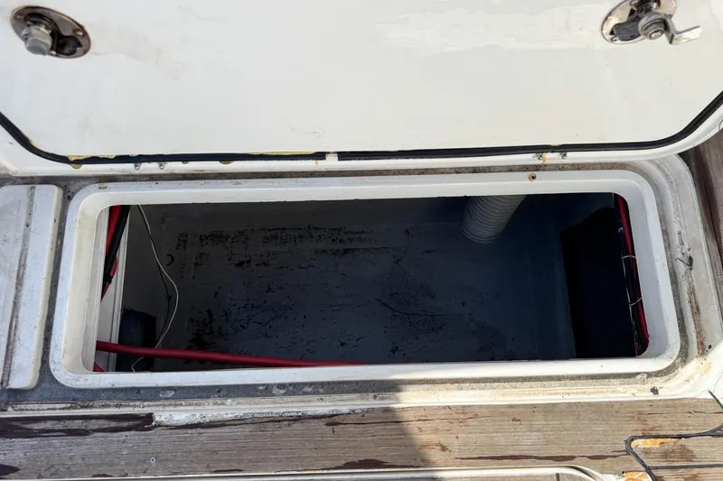 Slide: The Image of Open storage compartment on a 2004 Sunseeker Sportfisher 37 boat. - 79
