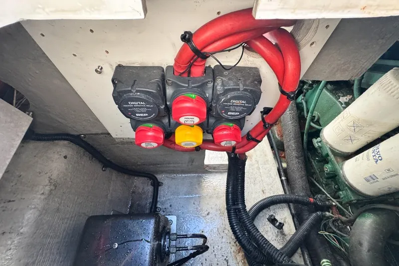 Slide: The Image of Engine compartment of 2004 Sunseeker Sportfisher 37 with electrical components and wiring. - 80