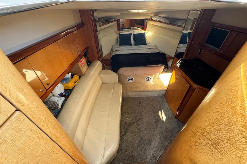Slide: The Image of Interior of 2004 Sunseeker Sportfisher 37 yacht with cozy seating and bed. - 86