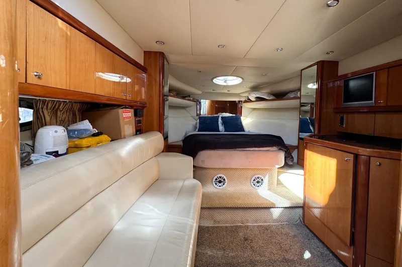 Slide: The Image of Luxurious interior of 2004 Sunseeker Sportfisher 37 yacht with cozy seating and elegant wood finishes. - 88