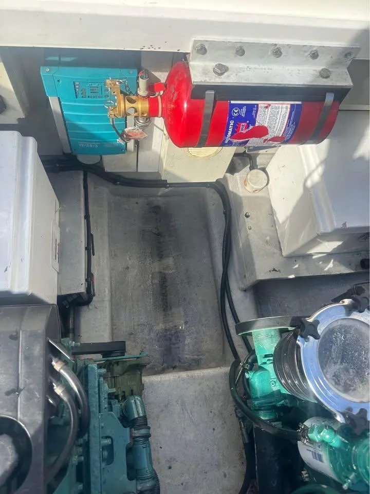 Slide: The Image of Aerial view of 2004 Sunseeker Sportfisher 37 yacht on clear green water. - 9